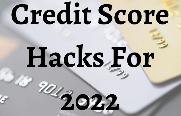 A close up of credit cards with the words " credit score hacks for 2 0 2 2 ".