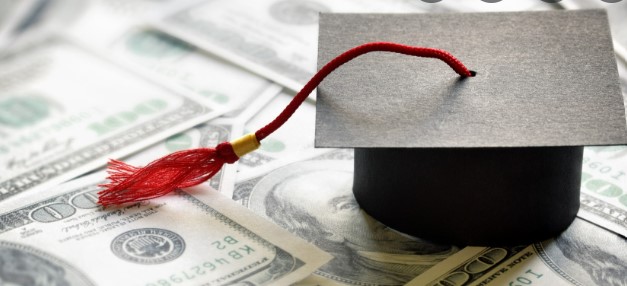 A red tassel is attached to the top of a graduation cap.